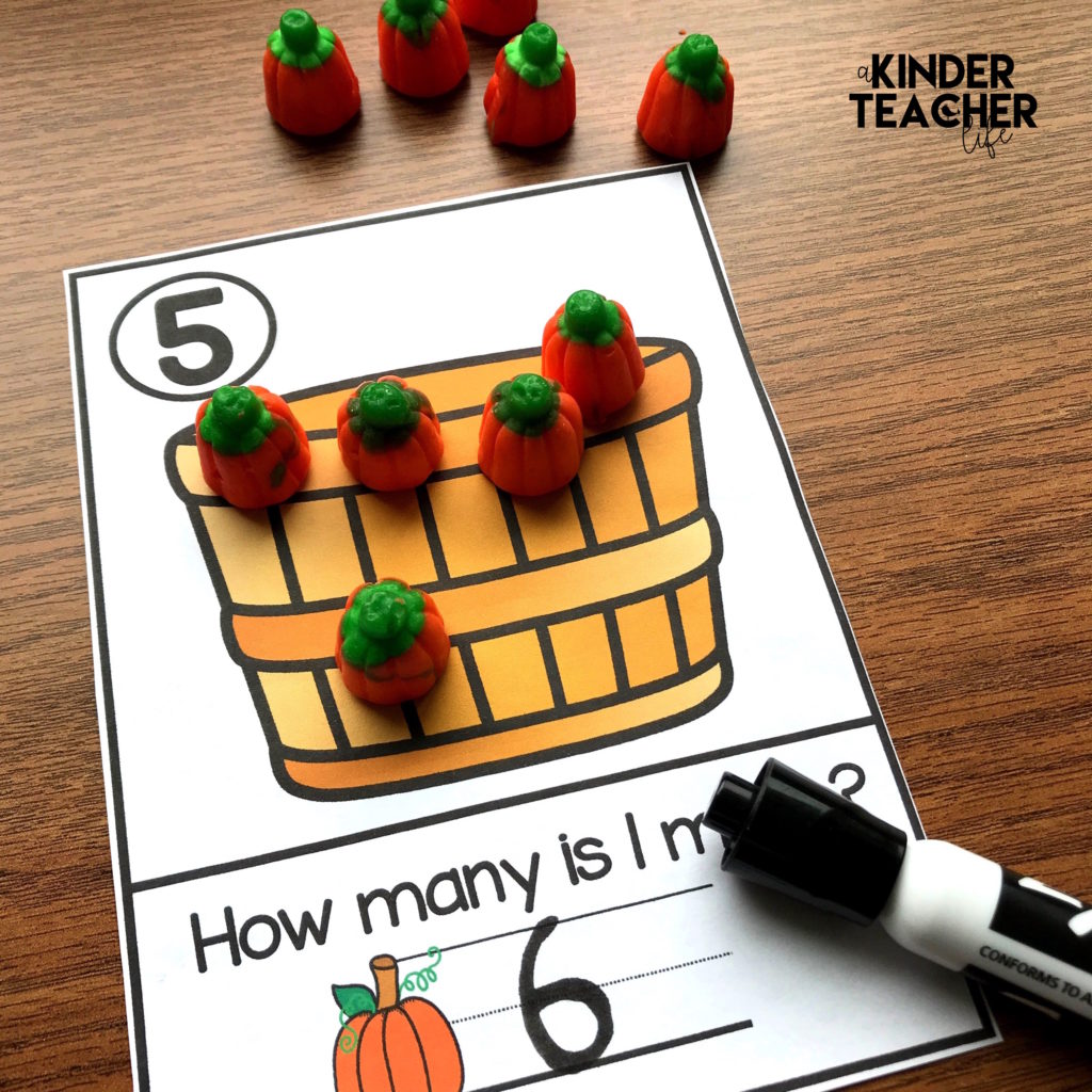 Free Halloween-themed math counting mats - Students build the number using objects and write 1 more.