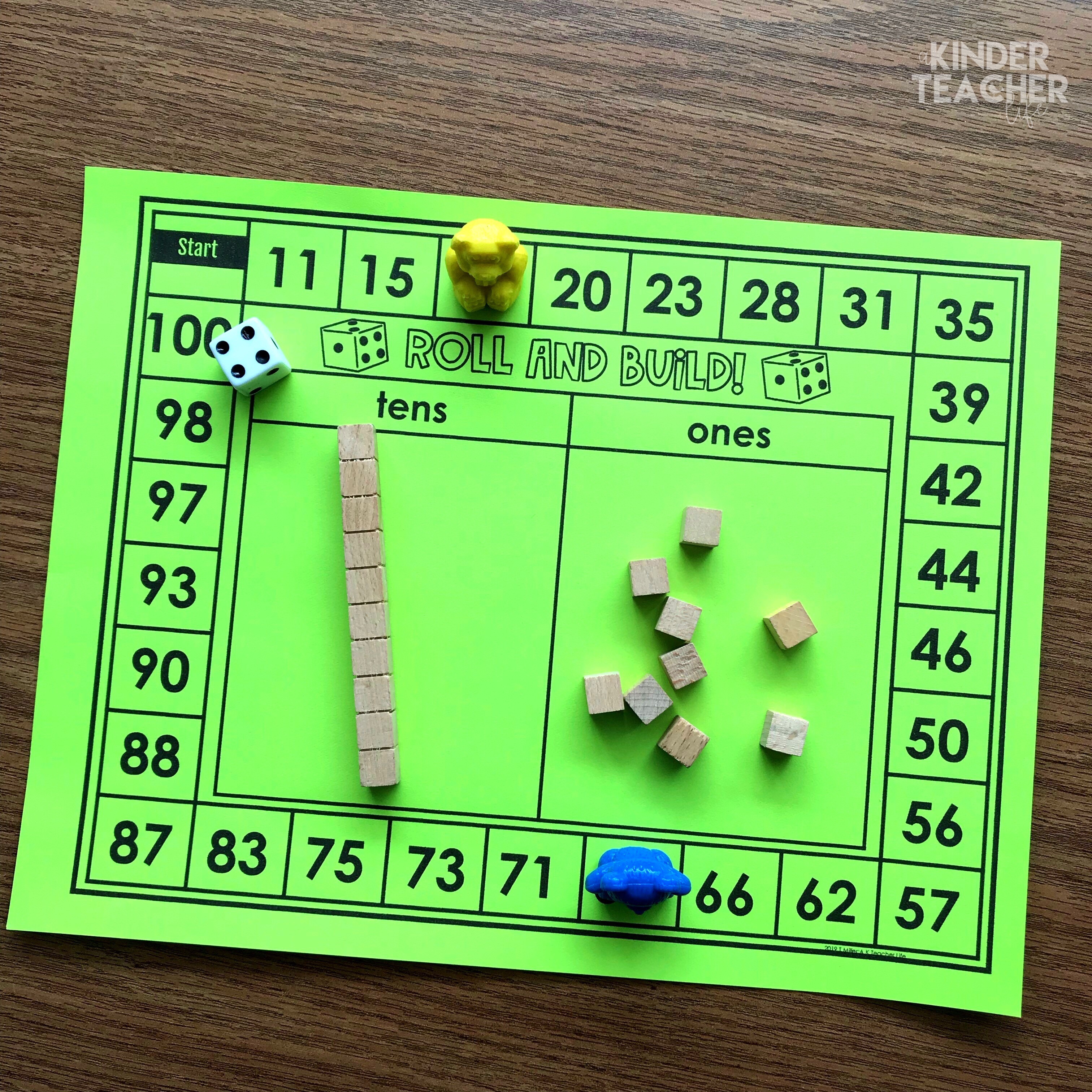 Place value game - students roll the dice and the number they land on is the number they build using base 10 blocks. 