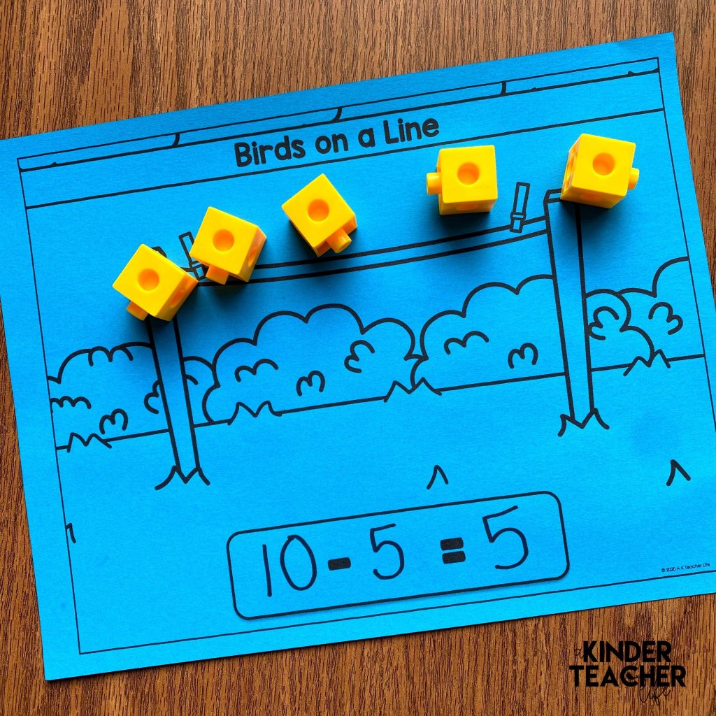 Subtraction Math Center Activity: Act out a math story using cubes and writing number sentences. 